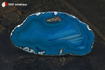 Tranche d'Agate teintée bleue du Brésil (contour dentelé, bande bleu foncé, bandes rectilignes intérieures) - 43 g / BL631 - Vignette | 1001 minéraux